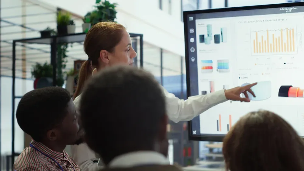 Colleagues reviewing performance charts together