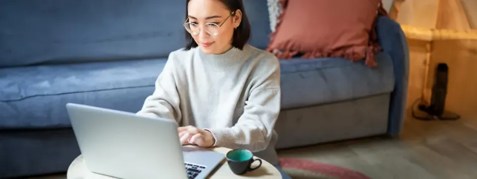 A resident managing their rent account on a laptop at home