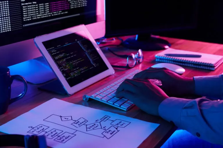 Close-up of a Neo Technology software developer working at his desk in a modern office environment.