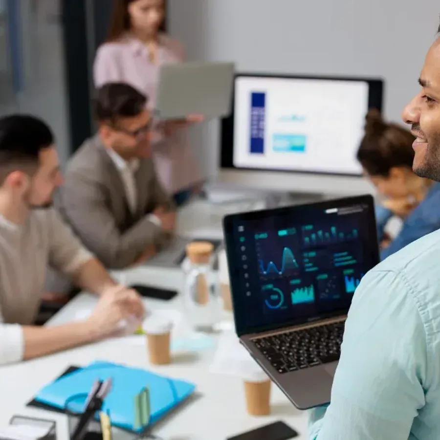 A team reviewing portfolio performance on screen