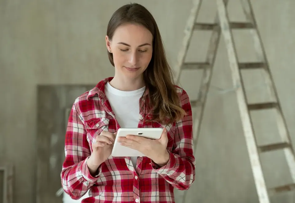 A surveyor recording an inspection on a tablet