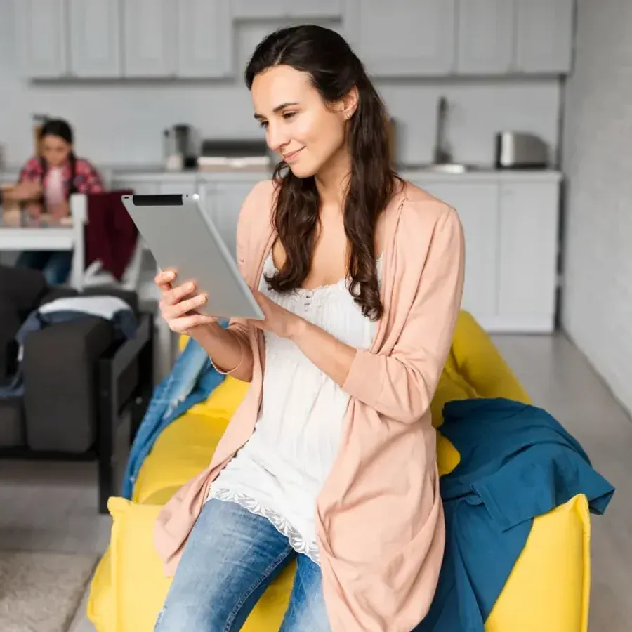 An occupier checking her rent account on a tablet at home