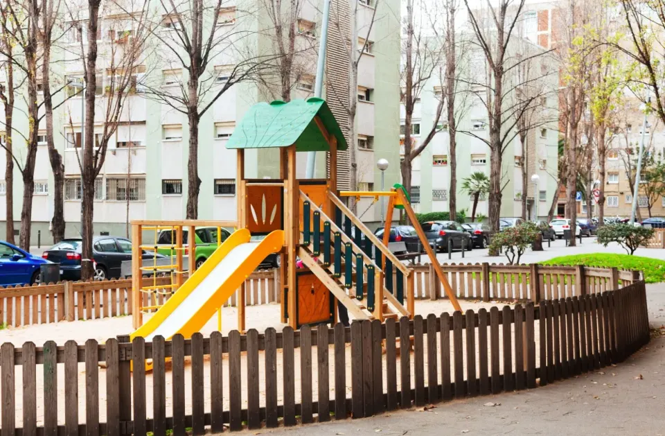 A fenced play area on a housing estate