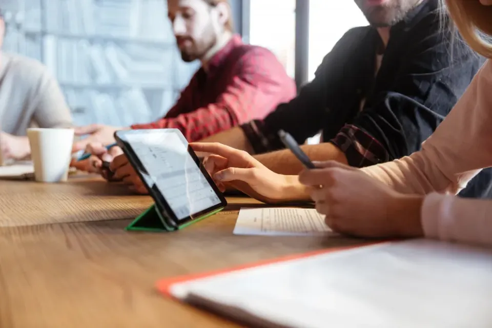 A team working together on tablets