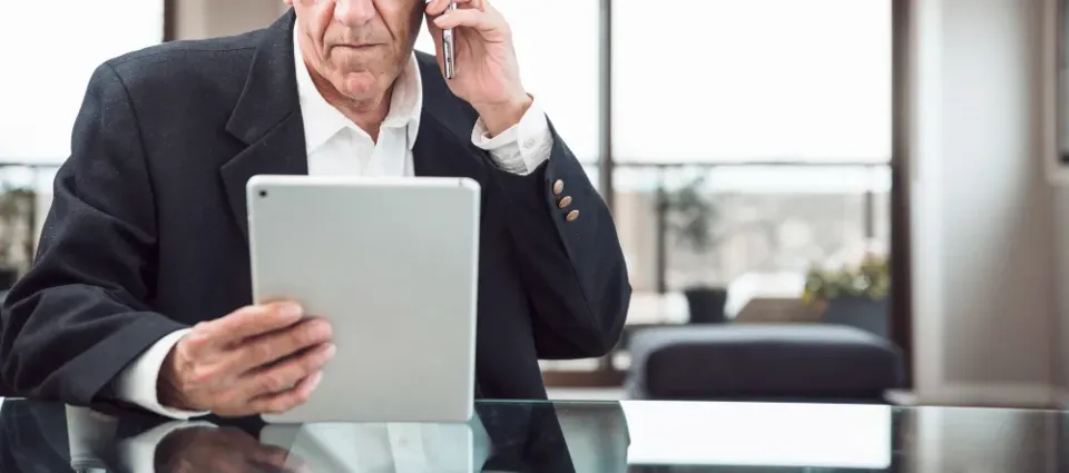 An executive reviewing data governance on a tablet