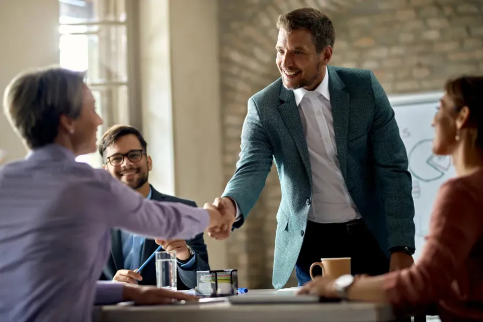 A handshake at the end of a meeting