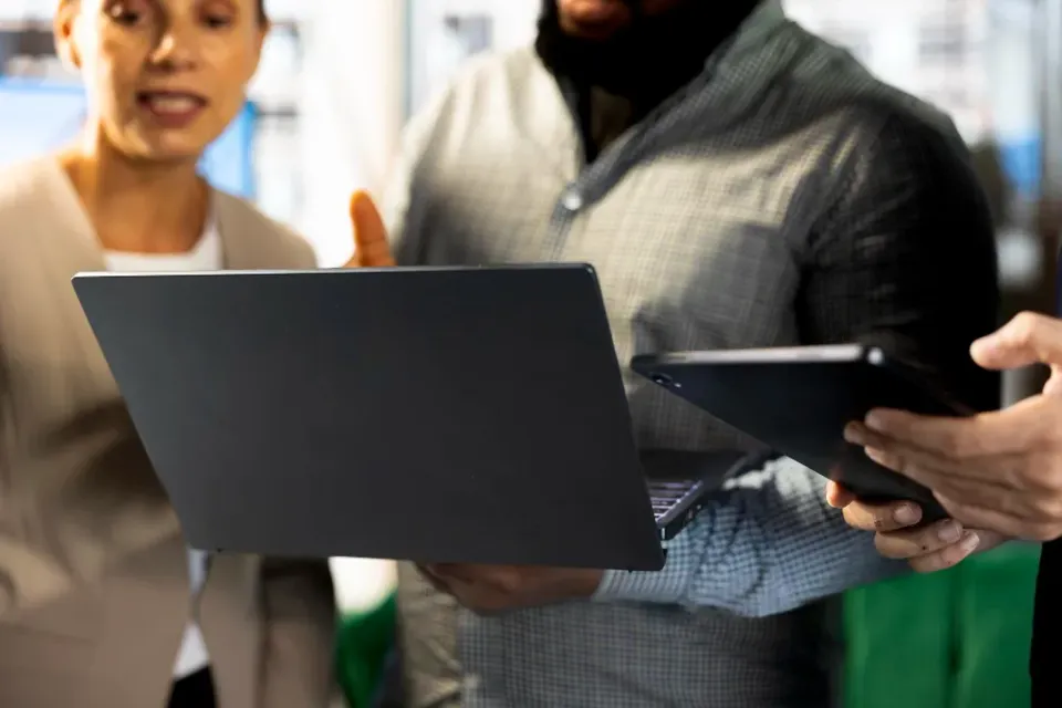 Colleagues checking the same answer on two devices