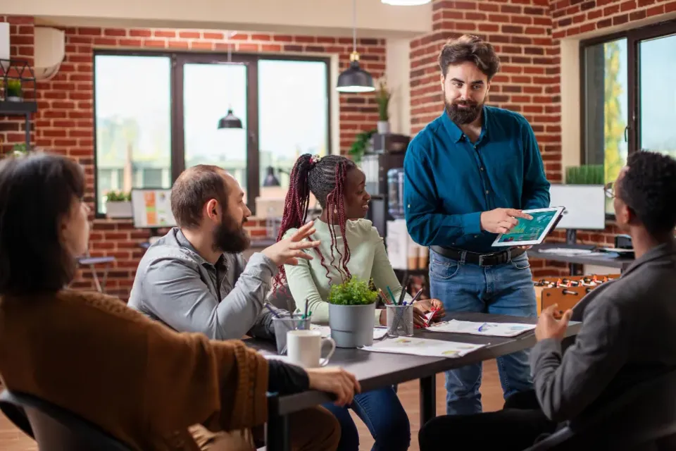 A project team working through a plan together