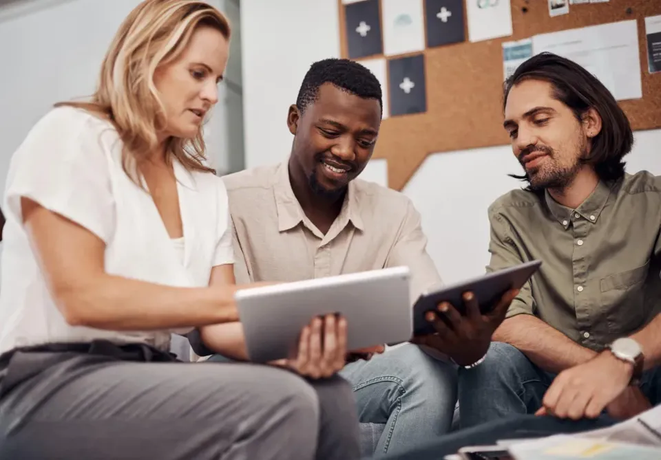 Colleagues planning together over a laptop
