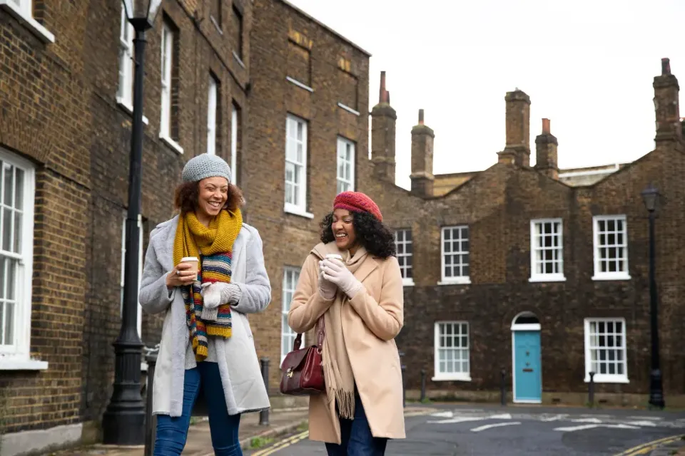 Residents outside their community housing homes